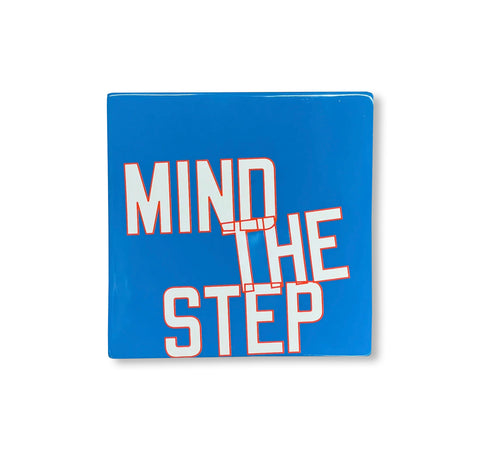 MIND THE STEP - GLAZED CERAMIC TILE by Lawrence Weiner