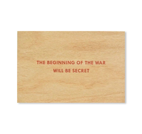 THE BEGINNING OF THE WAR WILL BE SECRET WOODEN POSTCARD by Jenny Holzer [RED TEXT]