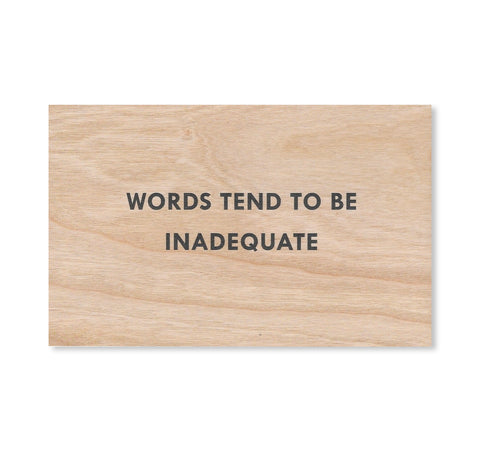 WORDS TEND TO BE INADEQUATE WOODEN POSTCARD by Jenny Holzer [BLACK TEXT]